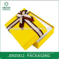 Fancy yellow jewelry box with ribbon
